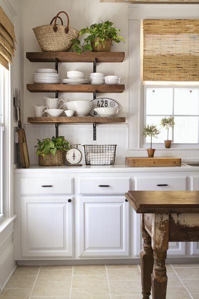 There are many ways and simple ideas to add warmth to your all white kitchen. Visit https://ablisfulnest.com/ to find out how! #interiors #kitchens #designertips