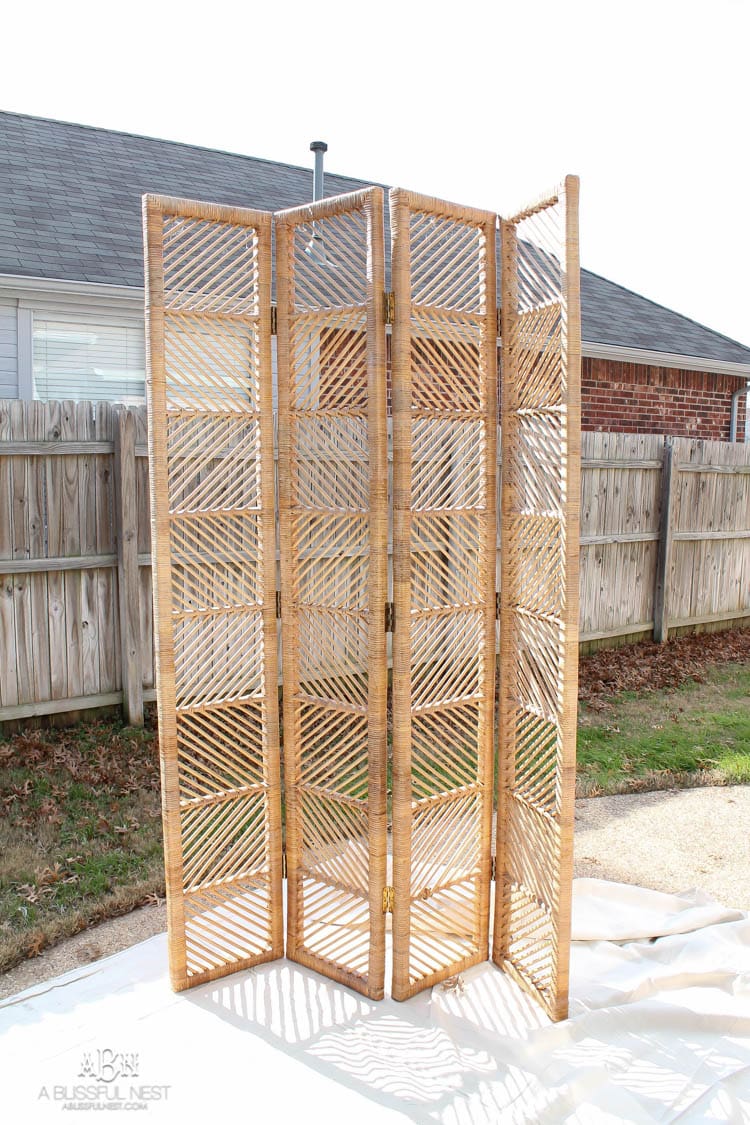 This thrifted rattan folding screen got a modern makeover with a gorgeous glossy navy Behr paint! What an incredible transformation! See more on https://ablisfulnest.com/ #behr #ad #rattanscreen #diytutorial #furnituremakeover