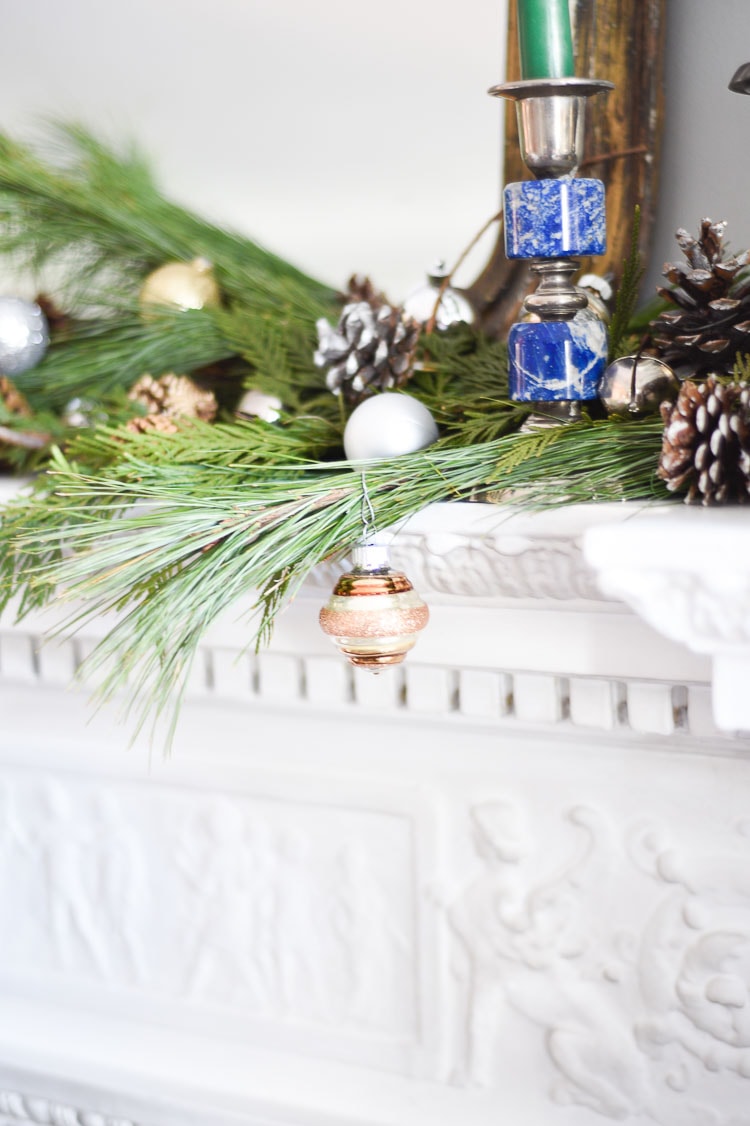 How to style your holiday table and mantel with vintage inspired holiday décor pieces, for more visit https://ablisfulnest.com #holidaydecor #holidaytablescape #holidaymantel