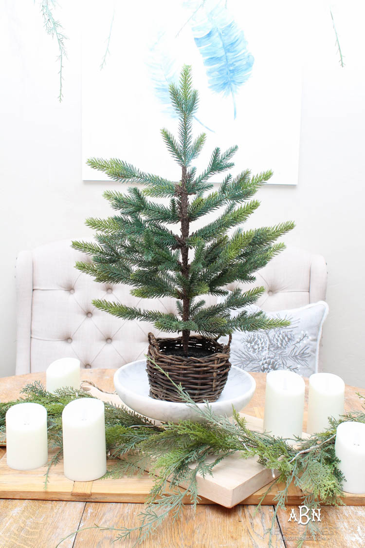 A classic christmas porch and beautiful neutral Christmas dining room idea. See more on https://ablisfulnest.com/ #christmasdecor #christmasideas #christmasfront porch #christmasdecoratingideas