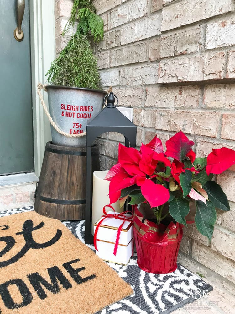A classic christmas porch and beautiful neutral Christmas dining room idea. See more on https://ablisfulnest.com/ #christmasdecor #christmasideas #christmasfront porch #christmasdecoratingideas
