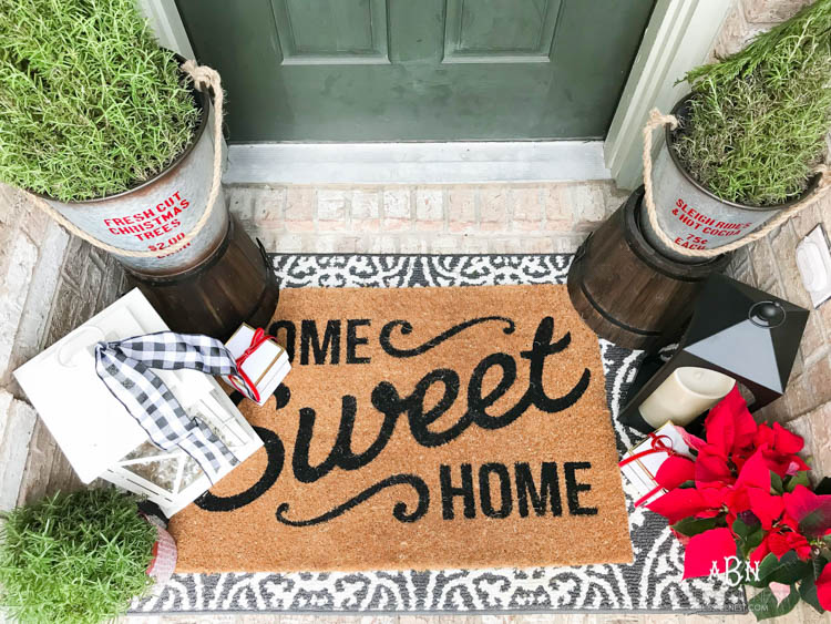 A classic christmas porch and beautiful neutral Christmas dining room idea. See more on https://ablisfulnest.com/ #christmasdecor #christmasideas #christmasfront porch #christmasdecoratingideas