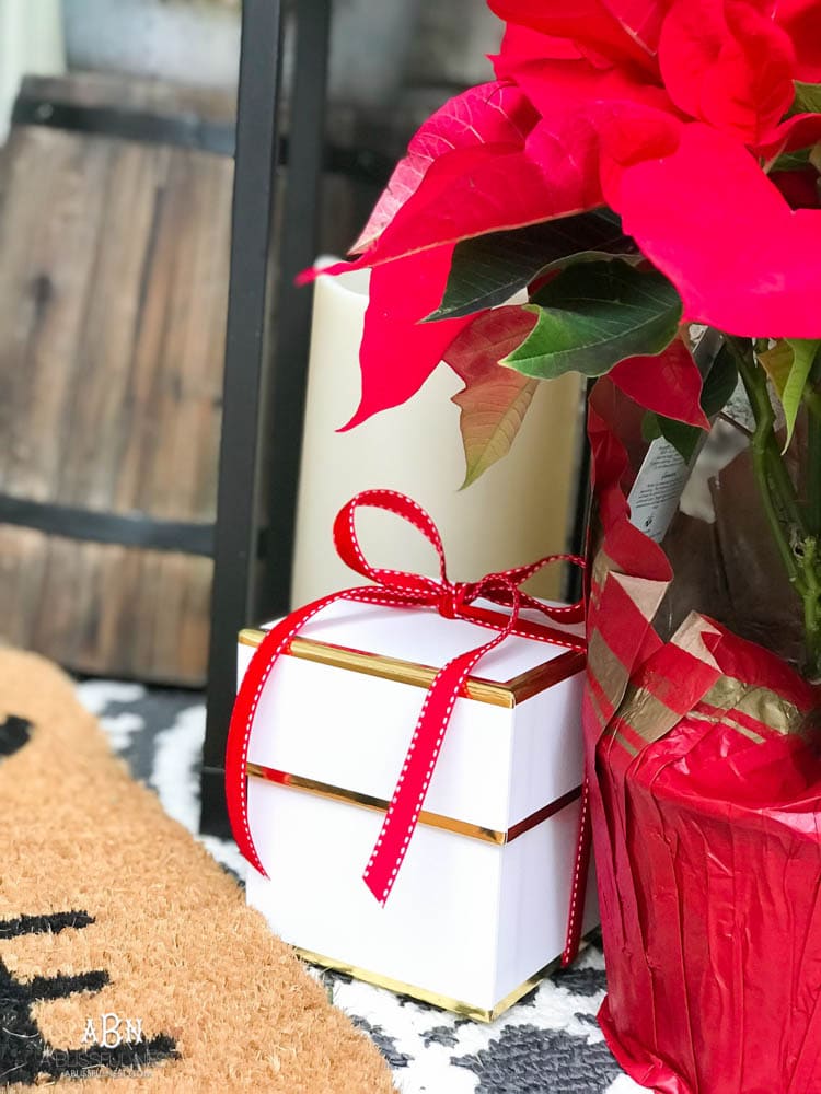 A classic christmas porch and beautiful neutral Christmas dining room idea. See more on https://ablisfulnest.com/ #christmasdecor #christmasideas #christmasfront porch #christmasdecoratingideas