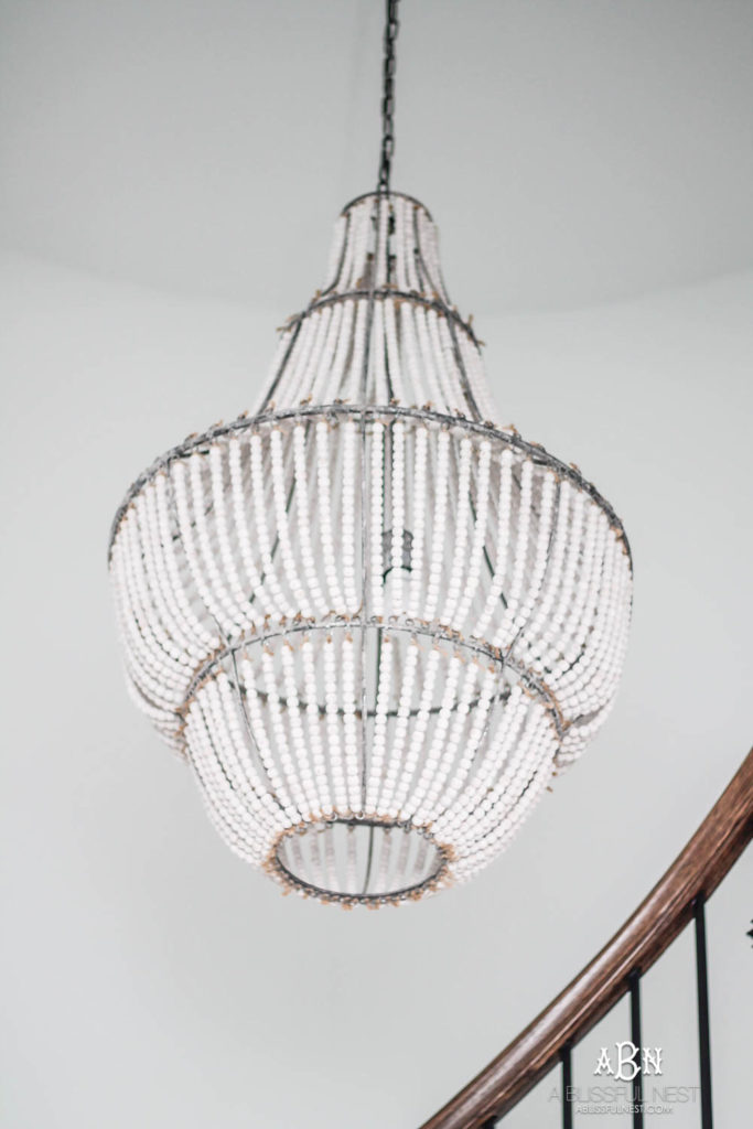 Wood bead chandelier in a entryway