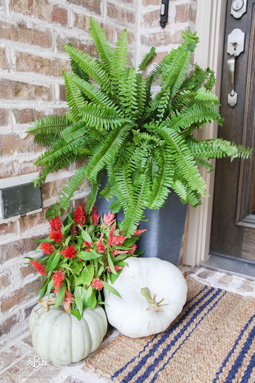 Gorgeous amber touches in this fall entry! Full sources on ablisfulnest.com #falldecor #fallentry #ABlissfulNest