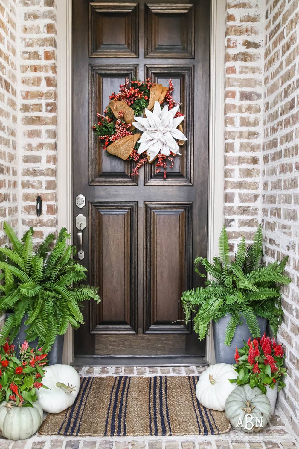 Gorgeous amber touches in this fall entry! Full sources on ablisfulnest.com #falldecor #fallentry #ABlissfulNest