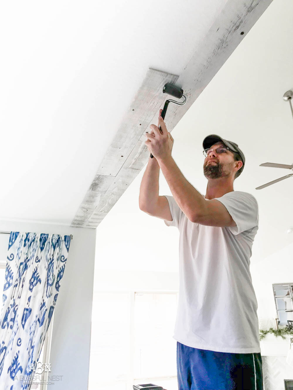 This is the simplest and easy way to install farmhouse barnwood on a ceiling! Just peel and stick these boards from Stikwood for a dramatic makeover to your plain ceiling or wall. More details on https://ablisfulnest.com #farmhousedecor #farmhouseproject #farmhousestyle #ad #stikwood
