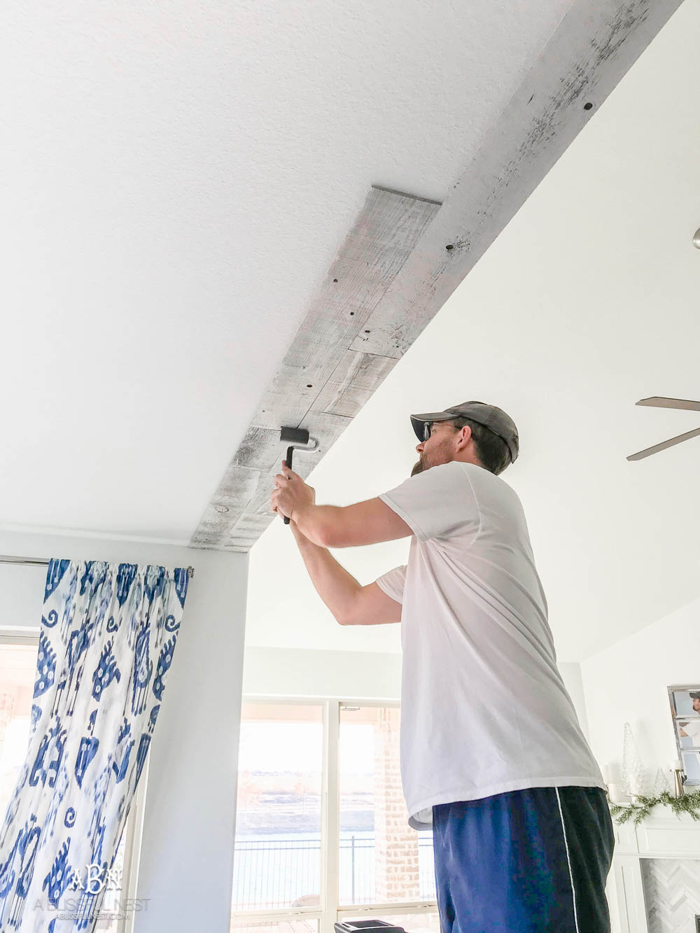 This is the simplest and easy way to install farmhouse barnwood on a ceiling! Just peel and stick these boards from Stikwood for a dramatic makeover to your plain ceiling or wall. More details on https://ablisfulnest.com #farmhousedecor #farmhouseproject #farmhousestyle #ad #stikwood