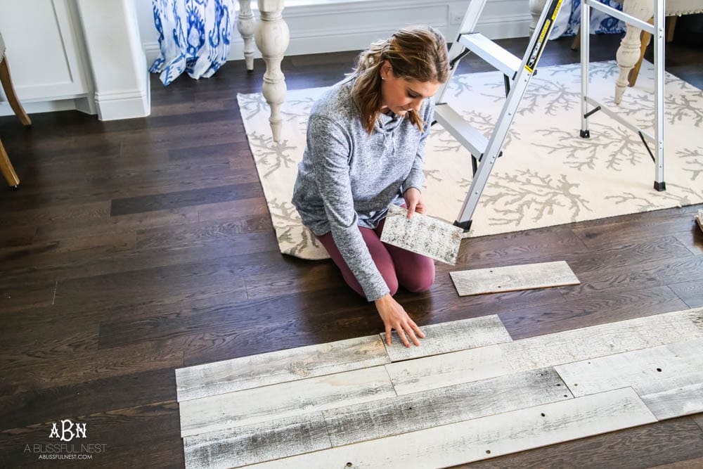 This is the simplest and easy way to install farmhouse barnwood on a ceiling! Just peel and stick these boards from Stikwood for a dramatic makeover to your plain ceiling or wall. More details on https://ablisfulnest.com #farmhousedecor #farmhouseproject #farmhousestyle #ad #stikwood