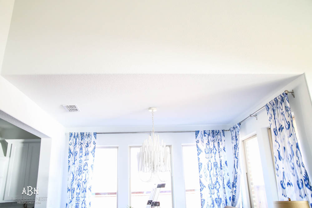 This is the simplest and easy way to install farmhouse barnwood on a ceiling! Just peel and stick these boards from Stikwood for a dramatic makeover to your plain ceiling or wall. More details on https://ablisfulnest.com #farmhousedecor #farmhouseproject #farmhousestyle #ad #stikwood