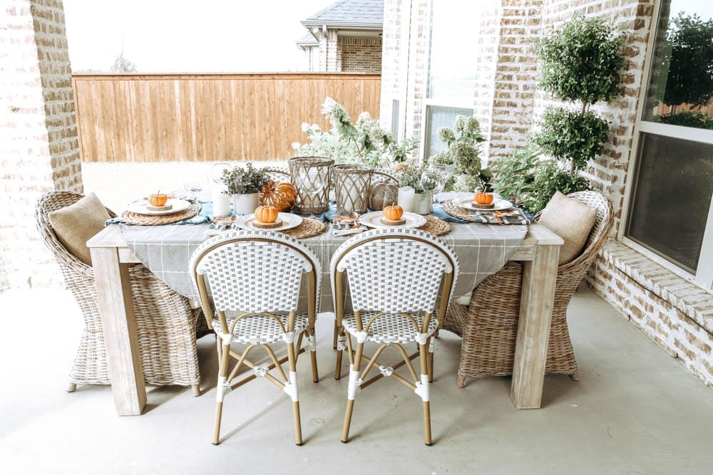 Outdoor autumn fall table with orange and blue accents. Gorgeous fall party idea. #ABlissfulNest #falldecor #fall #thanksgiving