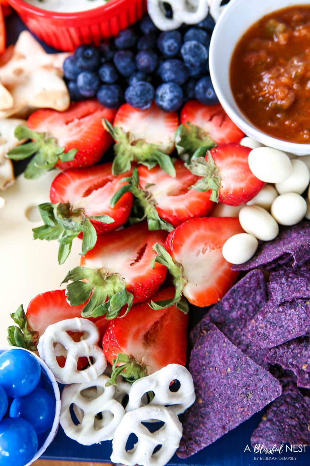 A beautiful patriotic charcuterie board with something for everyone. #ABlissfulNest #charcuterieboard #4thofjuly