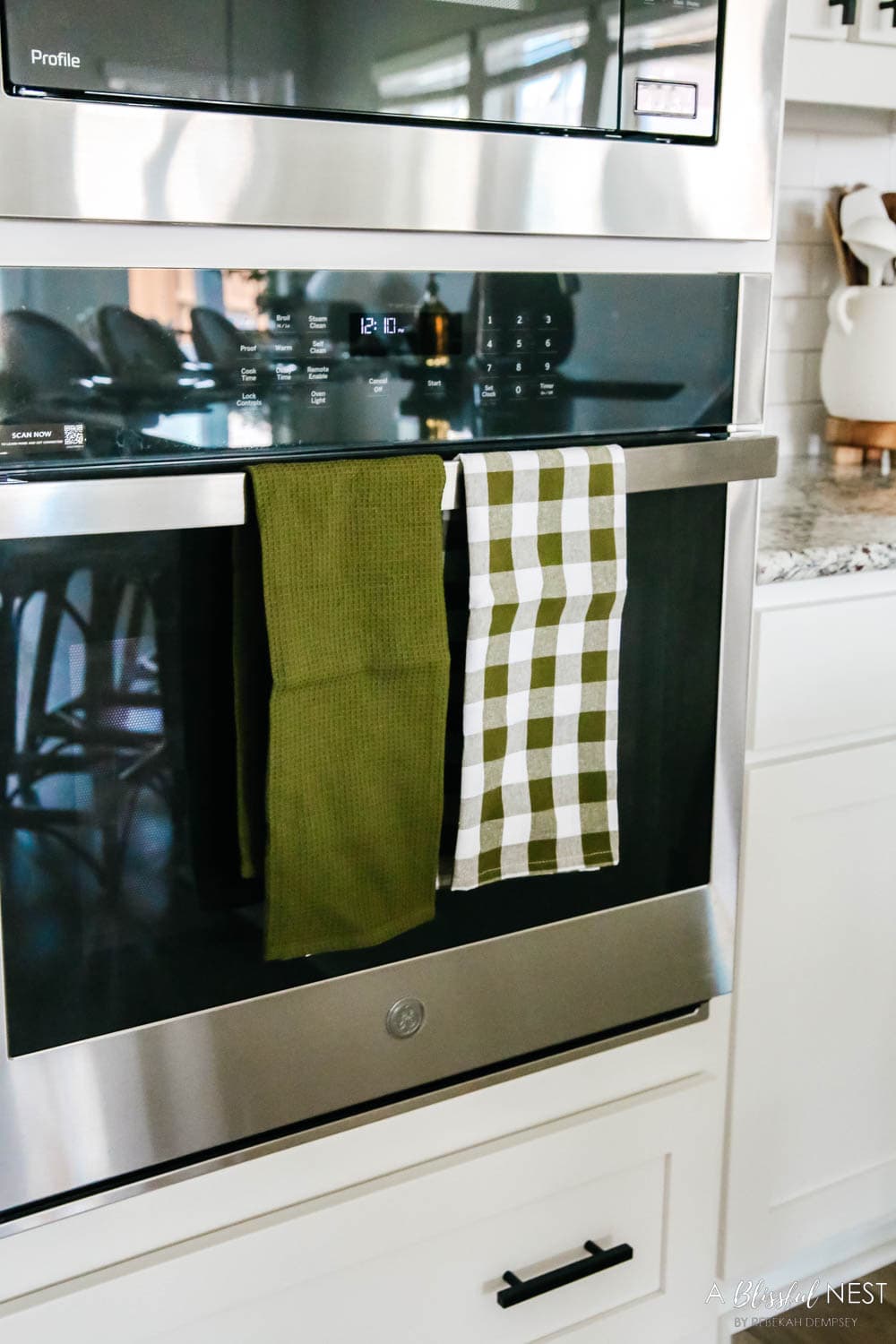 Green and white check towels hanging on