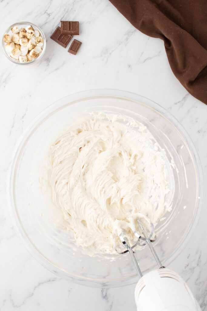 The frosting should look fluffy and have peeks in it after mixing. 