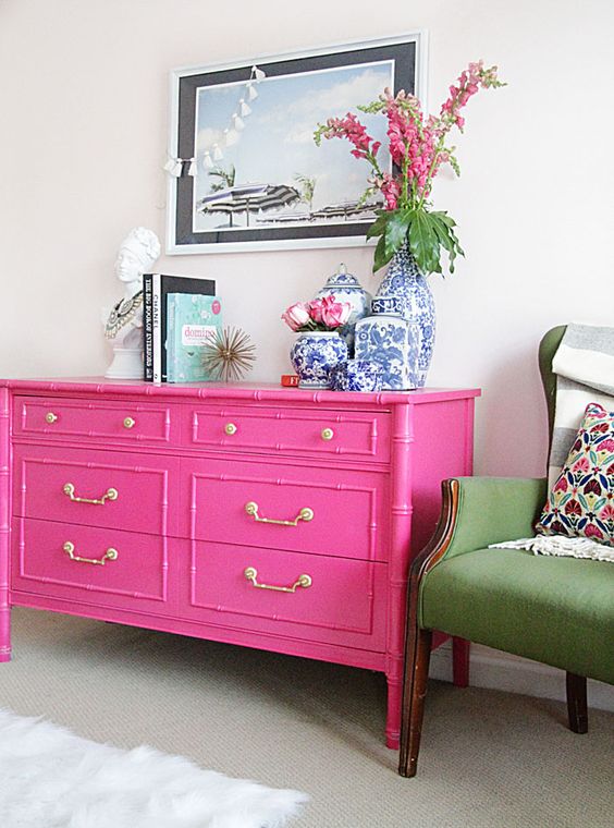Bright Viva Magenta color painted on a dresser