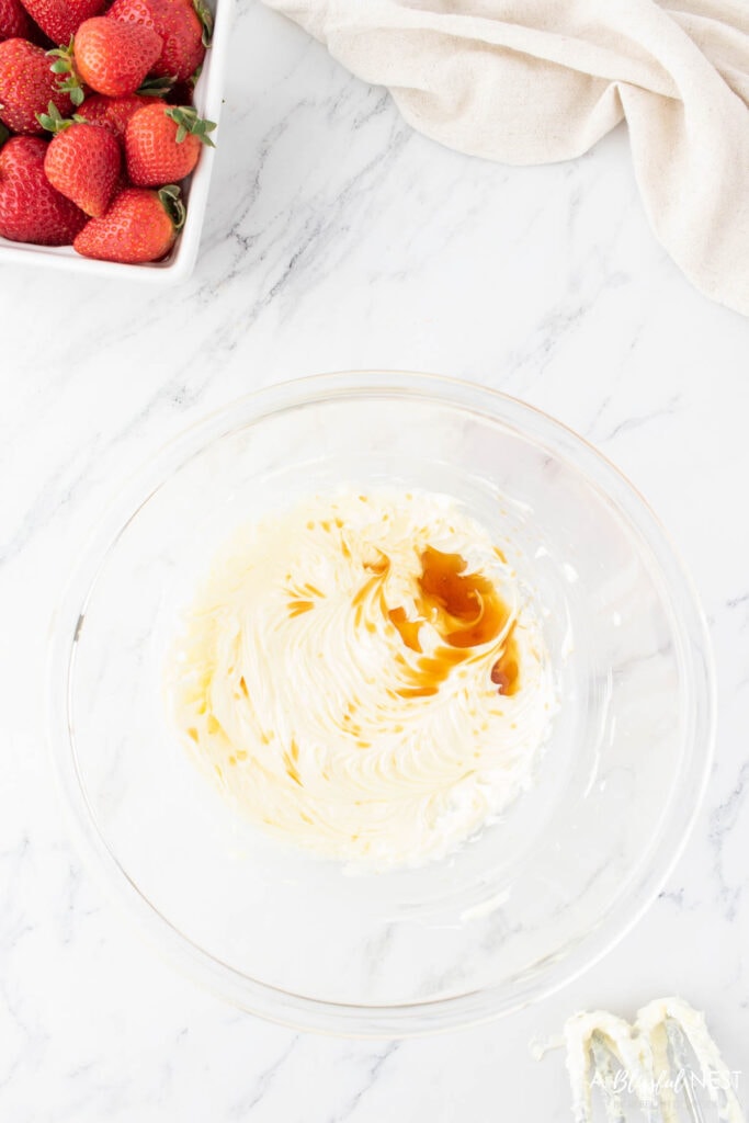 Softened butter and vanilla mixed together in a bowl