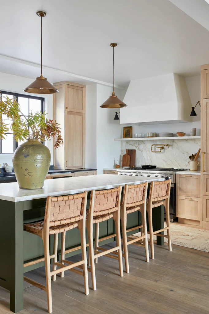 dark green kitchen island color, oak kitchen cabinets, white quartz countertops.