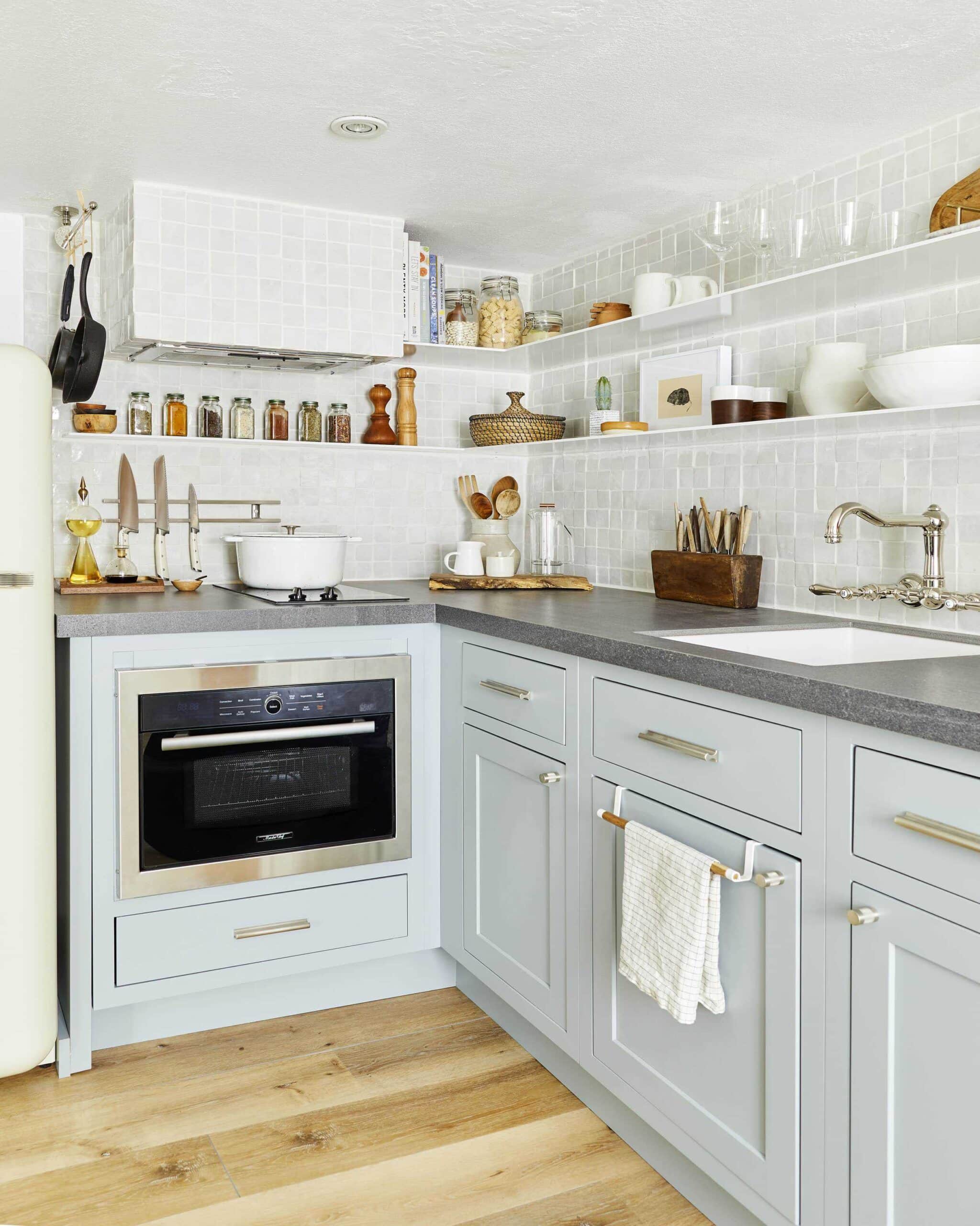 grey countertops with light grey cabinets, polished chrome hardware