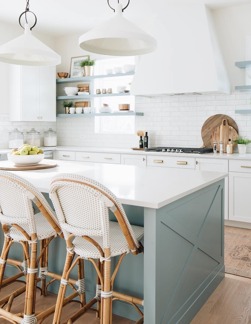 sage green kitchen island, white range hood, gold cabinet hardware, white quartz countertops