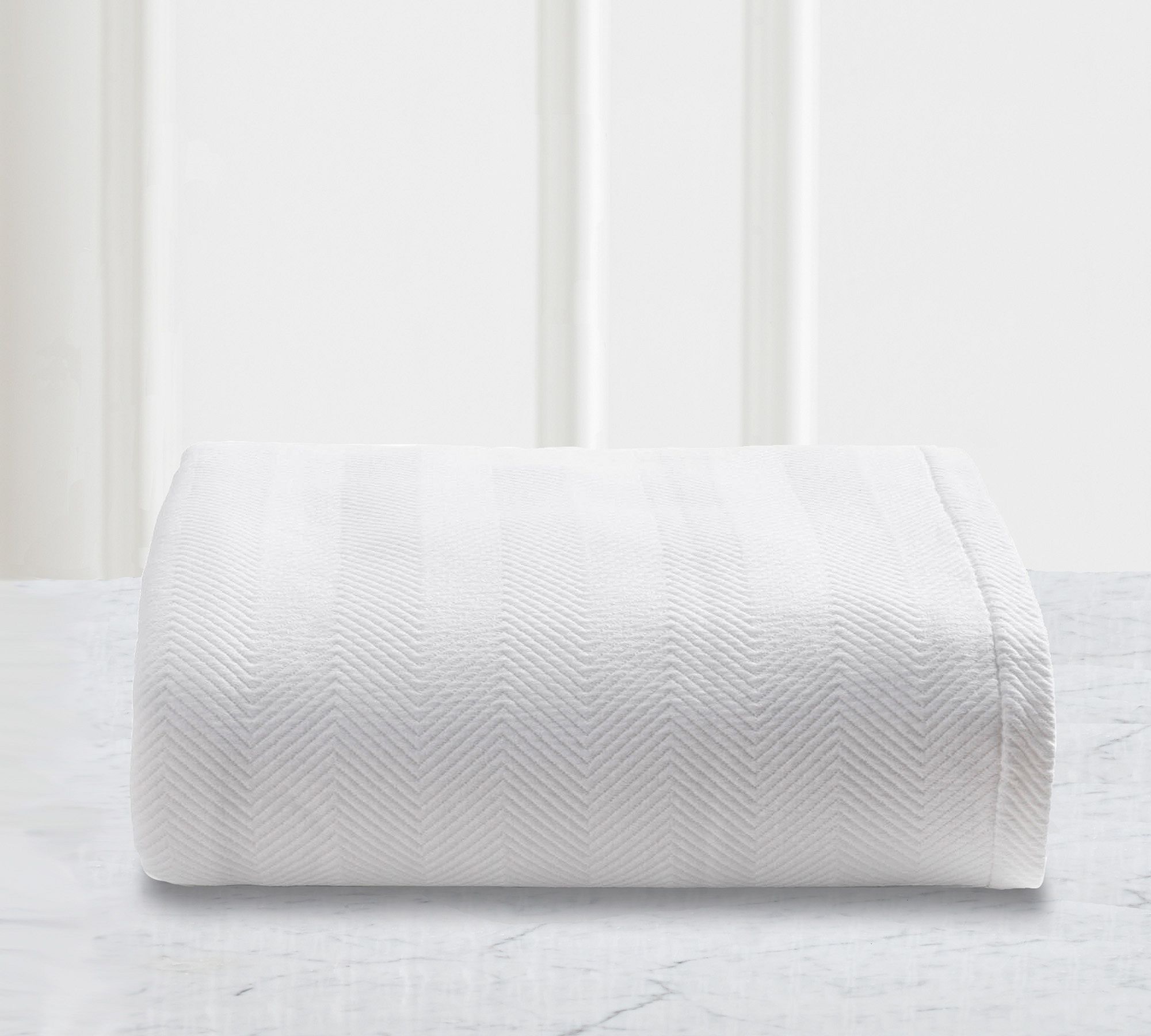 white coverlet blanket