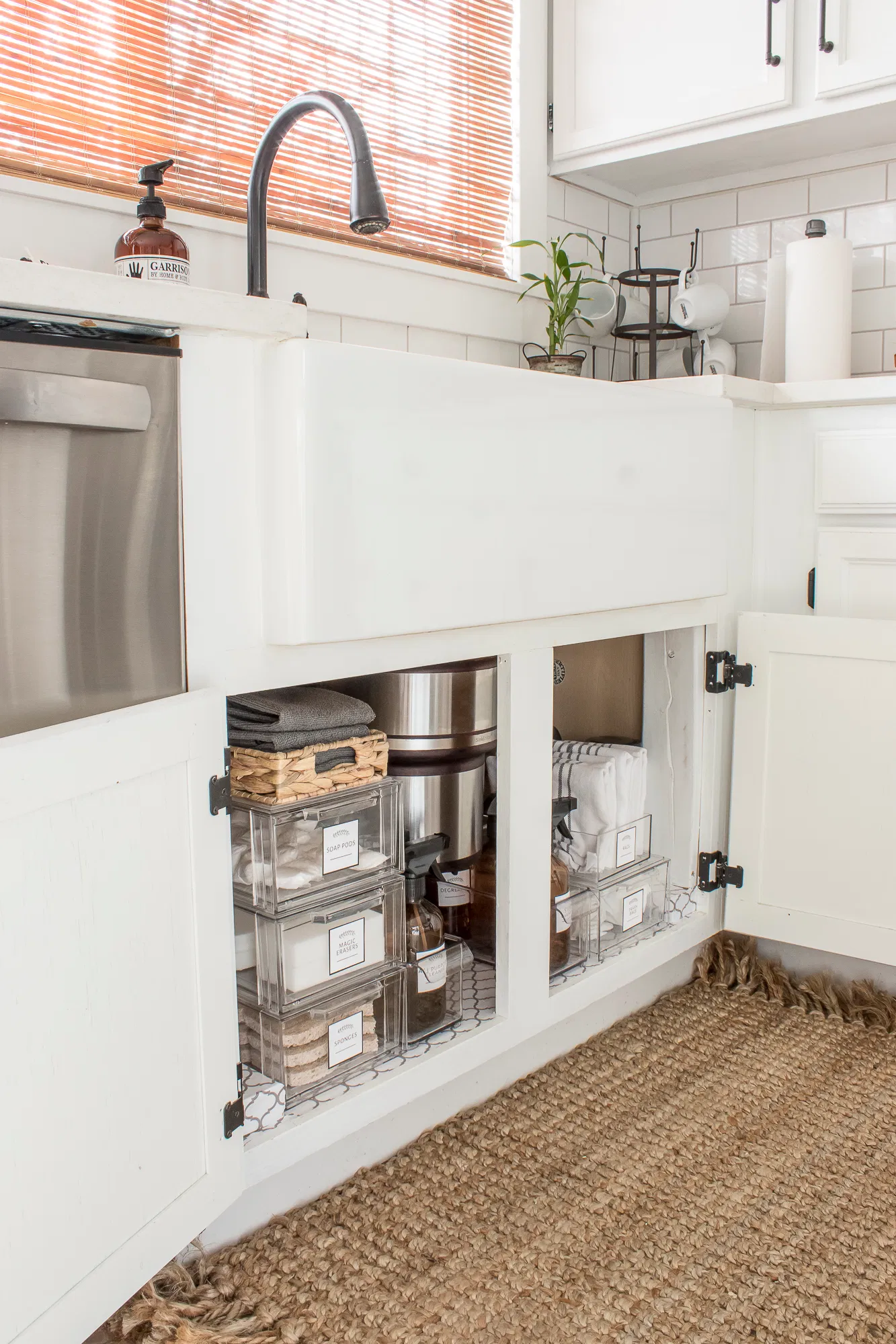 Clear bins under a sink to help organize under sink clutter