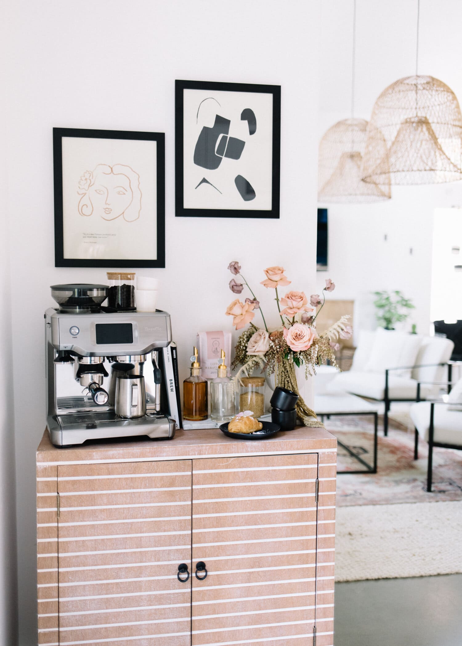 coffee bar created on top of a side cabinet in the corner of a room
