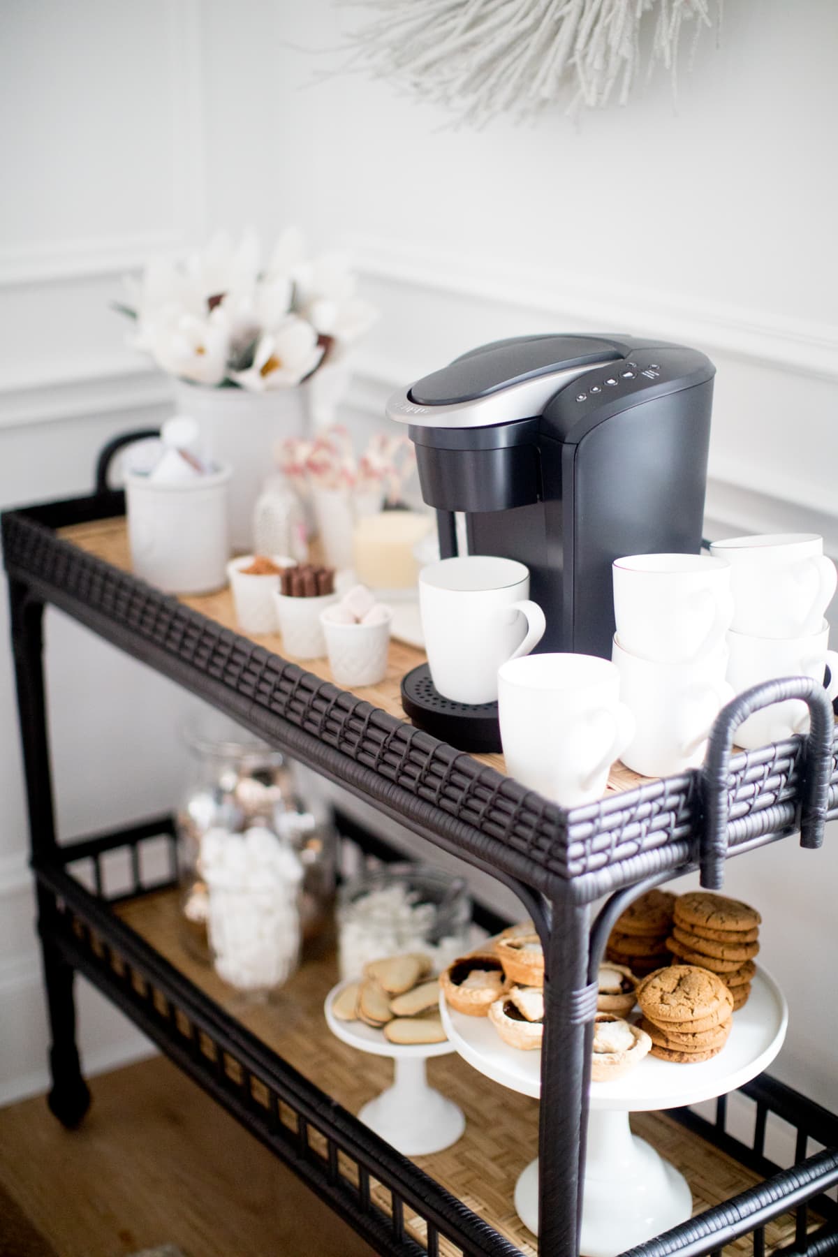 coffee bar set up on a rattan bar cart