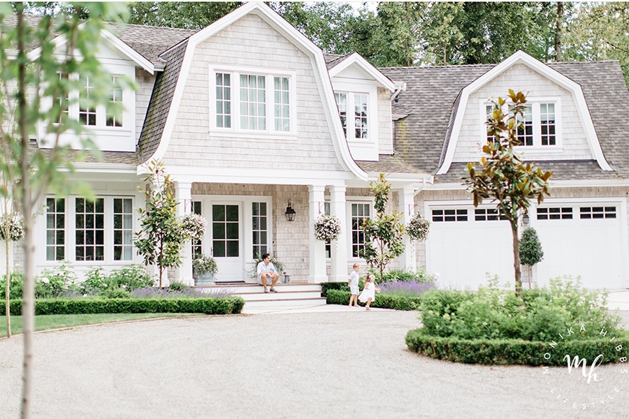 cape code style home with shingles on exterior and gable roof details