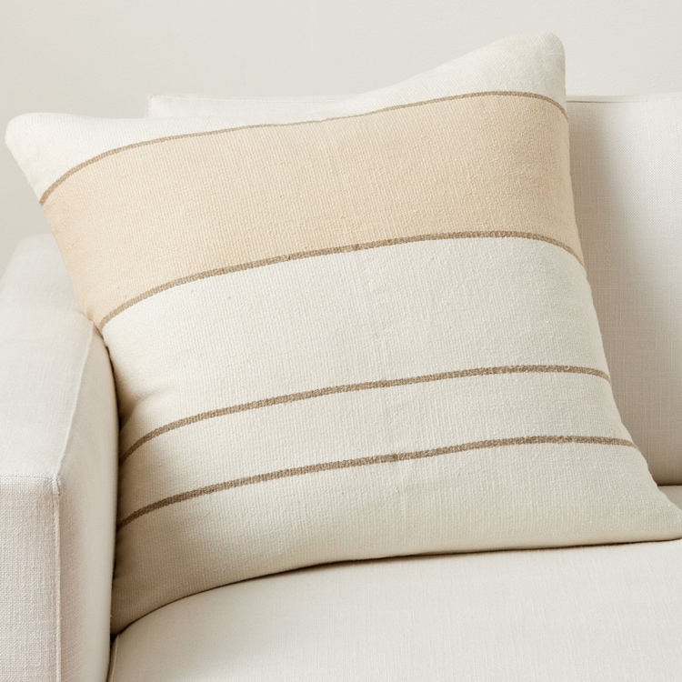 This neutral striped throw pillow will match all home styles and patterns! #ABlissfulNest