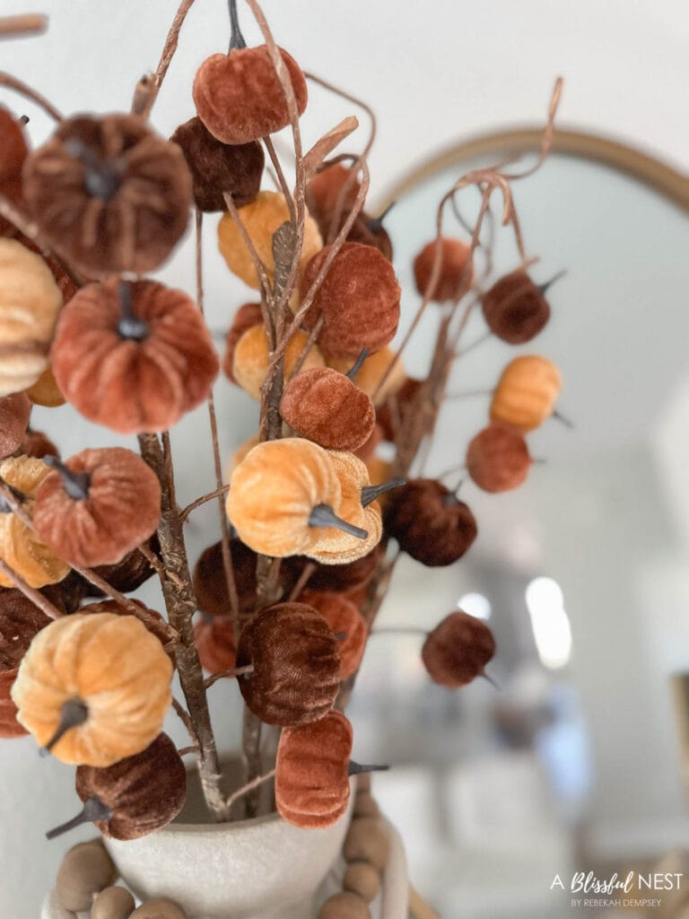 multi colored mini velvet pumpkins on a floral pick
