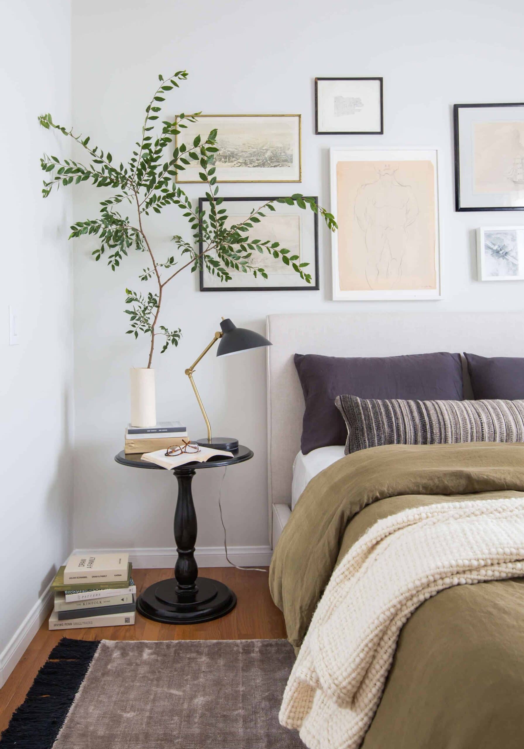 gallery wall art hanging above a bed