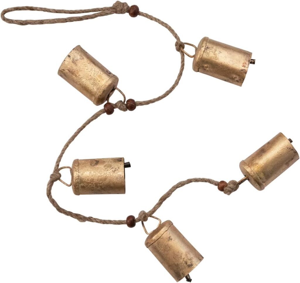 These gold hanging bells are under $10 and the perfect decor piece to add to your home for the holidays! #ABlissfulNest
