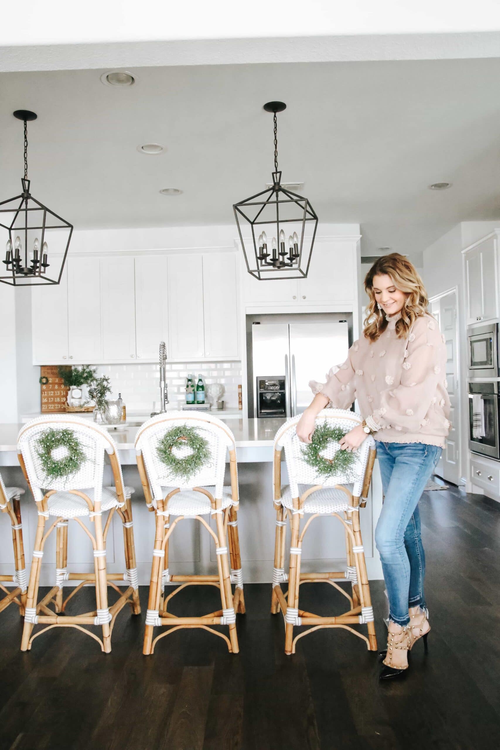 decorating the back of barstools for Christmas
