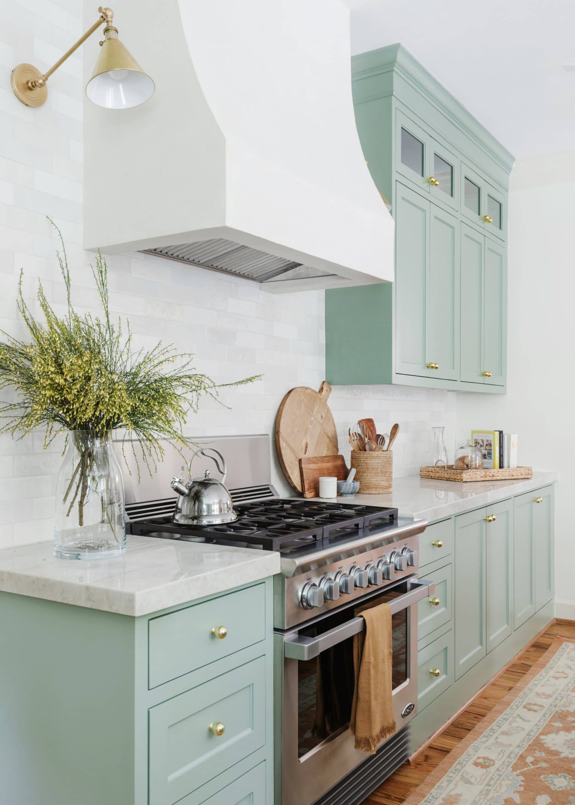 light mint green kitchen with white subway tile backsplash