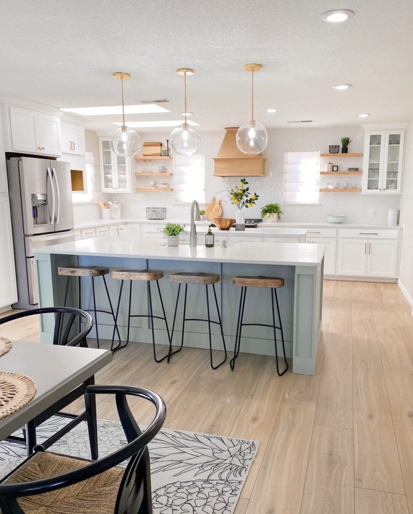 farmhouse style kitchen with light blue green kitchen island