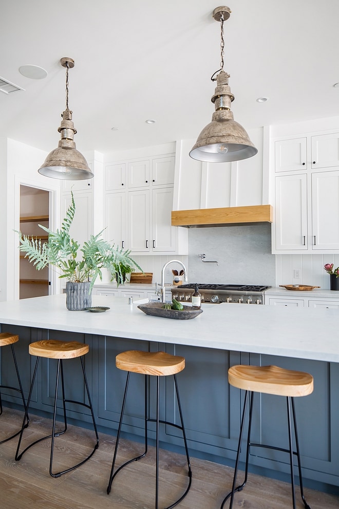 Farmhouse kitchen with dark blue kitchen island