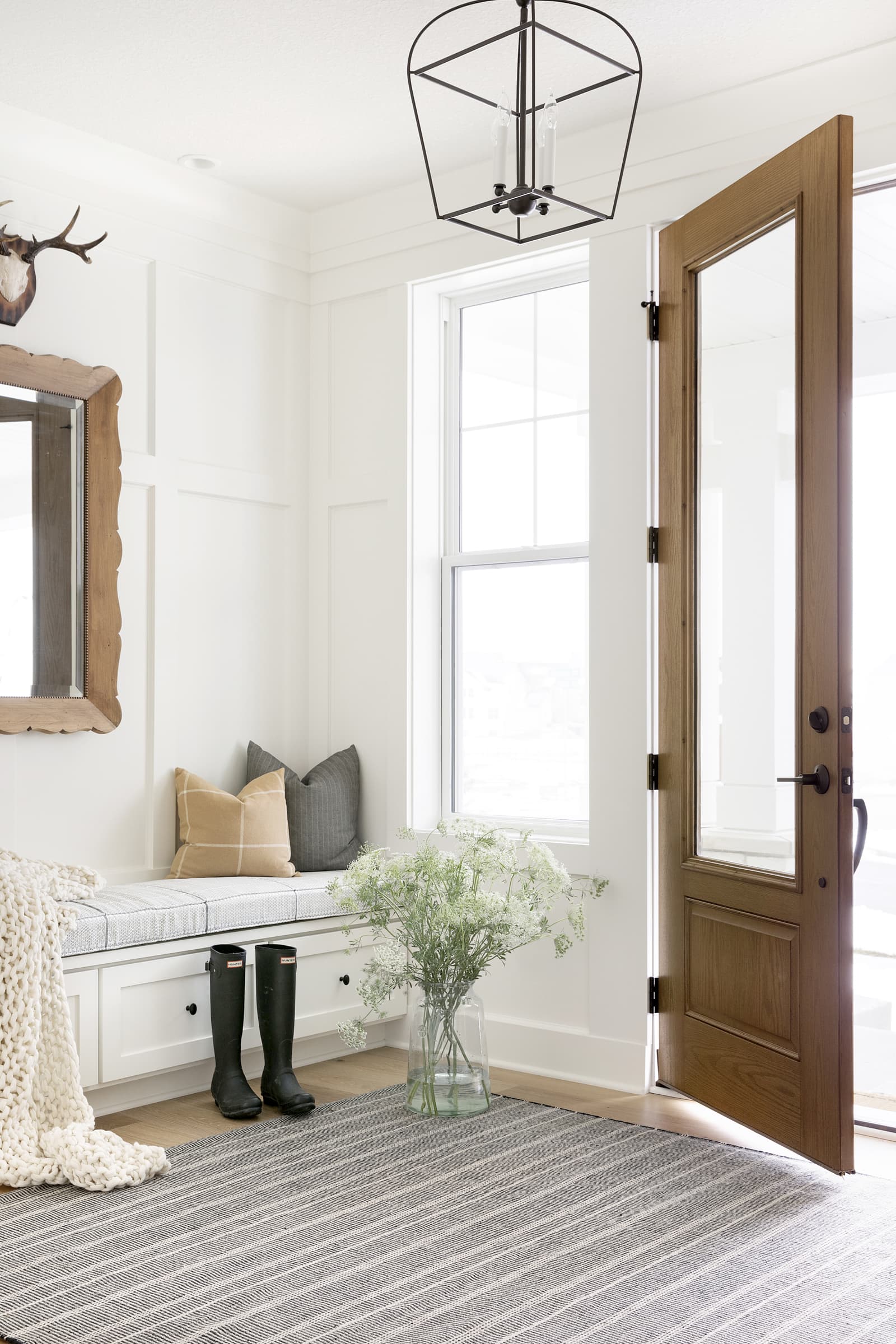 storage bench with cushion in an entryway