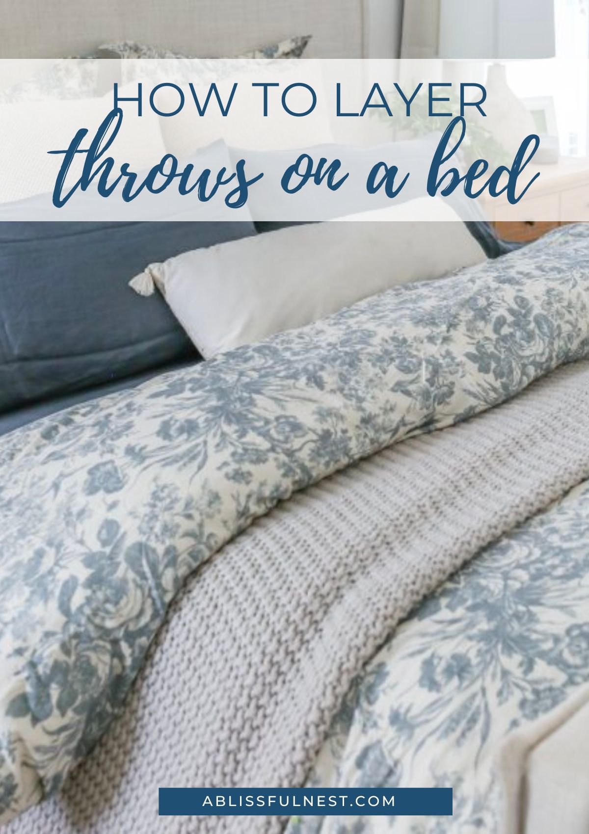blue and white bedding with white throw blanket