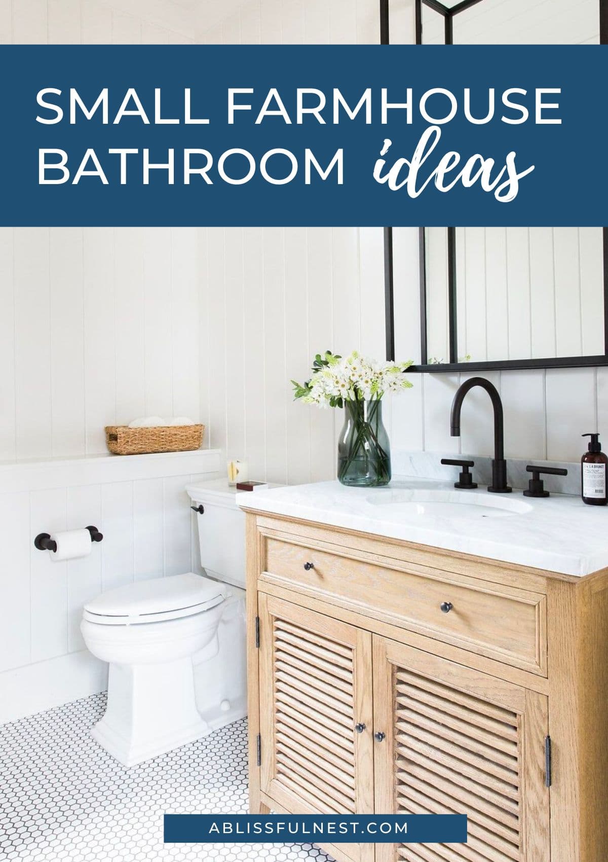 white penny tile for flooring, wood vanity, black hardware in this farmhouse bathroom