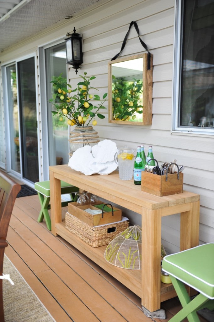 rustic wood table on a patio used for a outdoor bar area