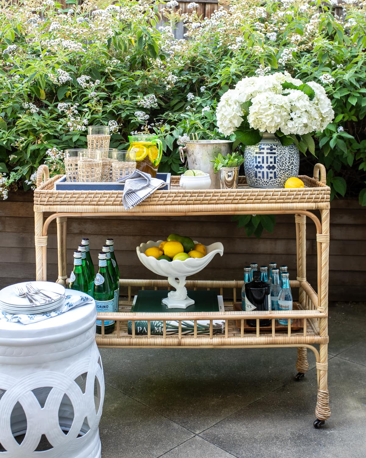 rattan bar cart used outdoors as a temporary outdoor bar