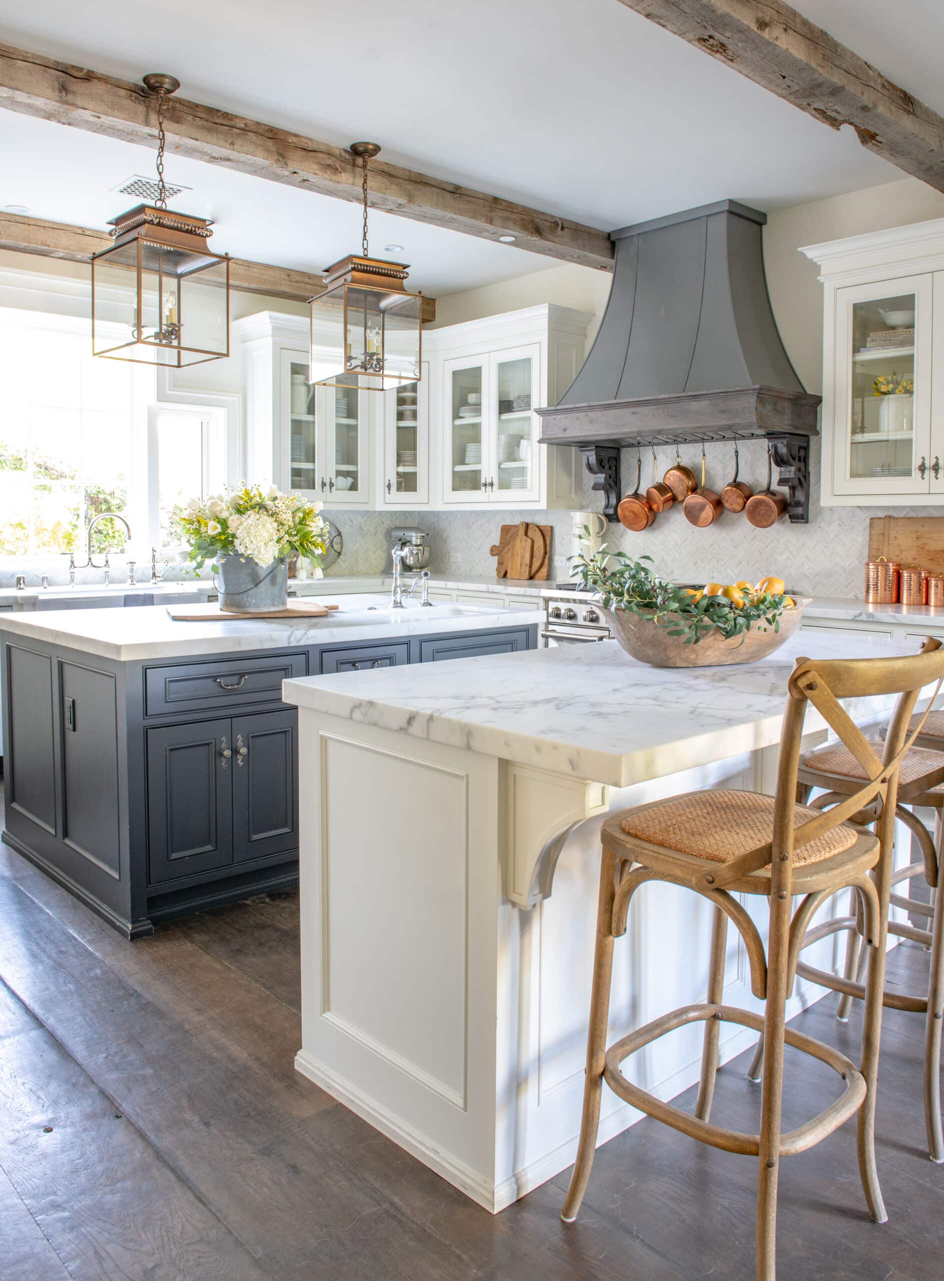 Gray and white kitchen with marble countertops