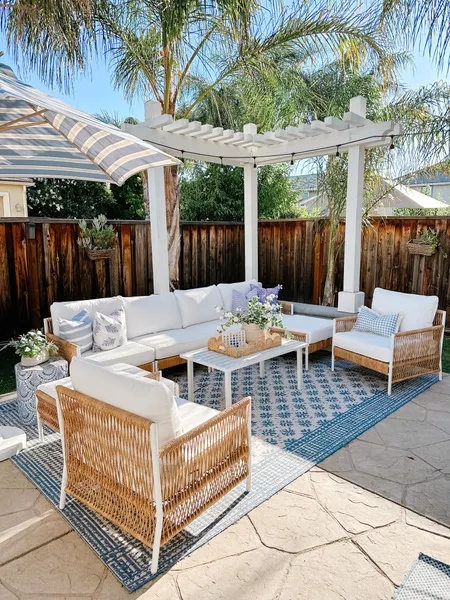 serena and lily seating set in white with blue and white outdoor rug